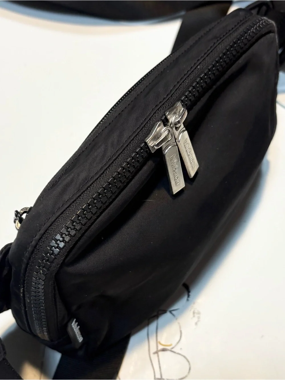 lululemon Everywhere Belt Bag 1L features a durable black nylon exterior